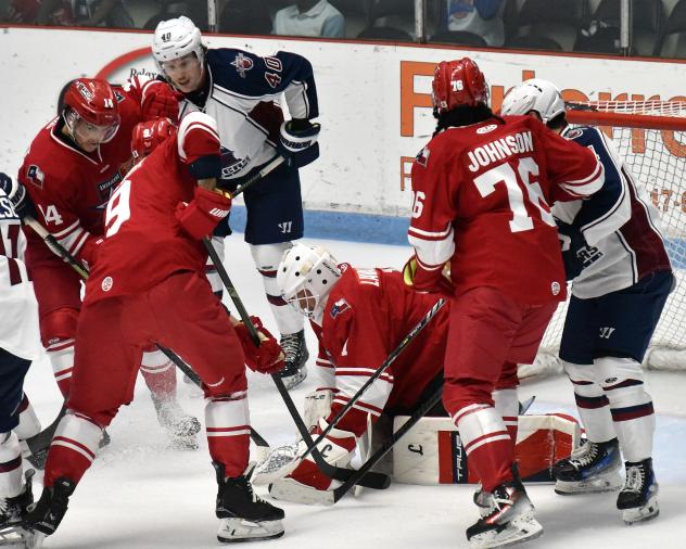 Allen Americans goaltender William Lavallière covers the puck against the Tulsa Oilers