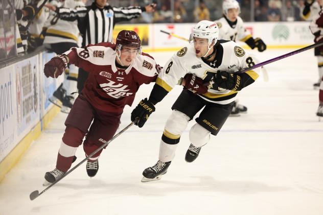 Peterborough Petes right wing Francis Parish (left) vs. the Kingston Frontenacs