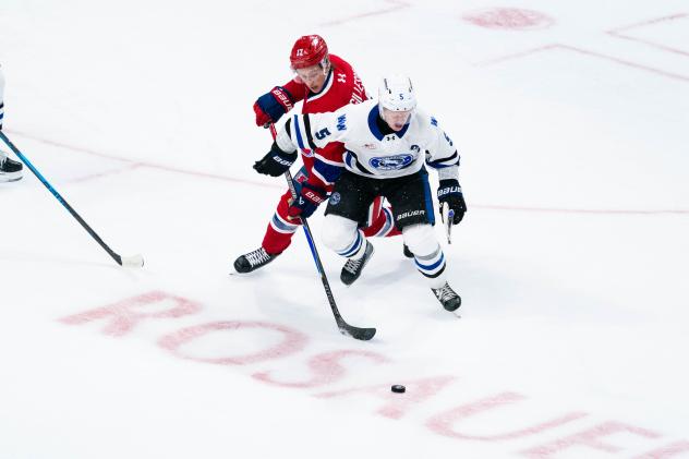 Spokane Chiefs' Brody Gillespie and Wenatchee Wild's Josh Fluker in action