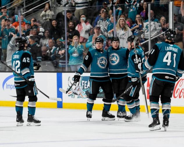 San Jose Barracuda gather following a goal