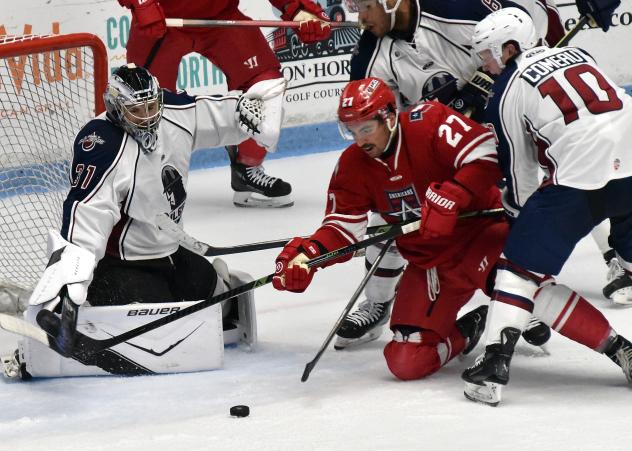 Allen Americans' Mark Duarte batles Tulsa Oilers' Troy Kobryn and Dallas Comeau