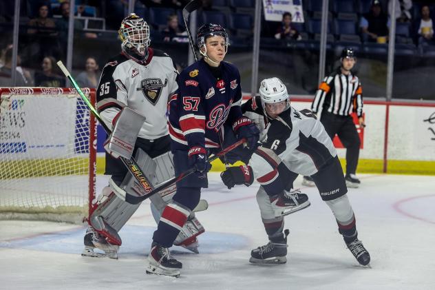 Vancouver Giants' Burke Hood and Lance McCloskey and Regina Pats' Zach Lansard on game night