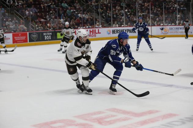 Syracuse Crunch defenseman Maxim Groshev (right) vs. the Hershey Bears