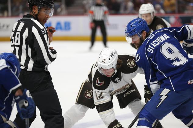 Syracuse Crunch left wing Wojciech Stachowiak faces off with the Hershey Bears