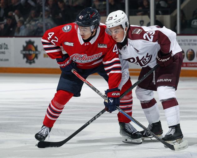 Peterborough Petes centre Braydon McCallum (right) vs. the Oshawa Generals