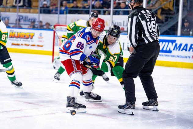 Kitchener Rangers centre Luca Romano tied up against the London Knights