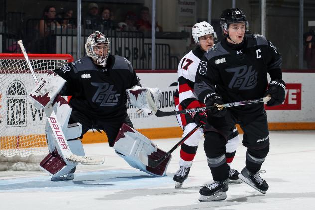Peterborough Petes goaltender Easton Rye and defenceman Carson Cameron