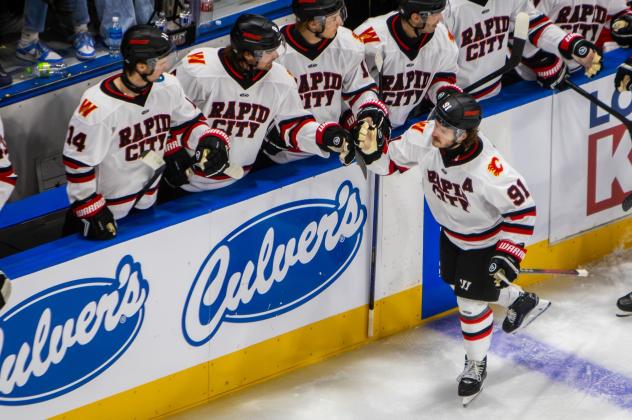 Rapid City Rush forward Blake Bennett received congratulations along the bench