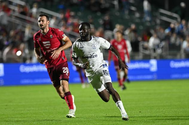 Rhode Island FC forward Albert Dikwa (right) vs. North Carolina FC