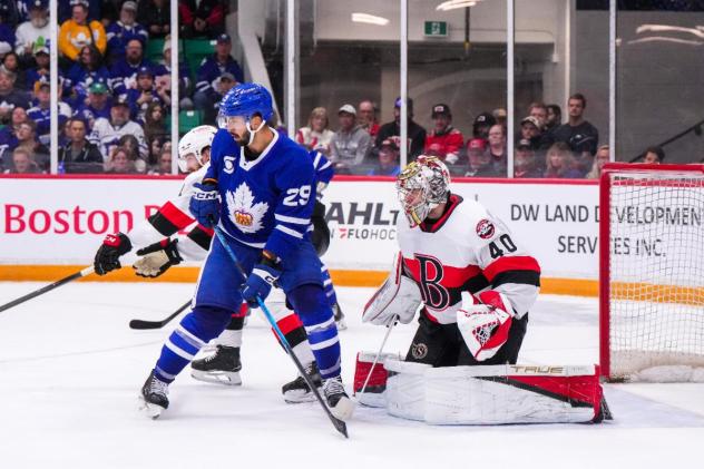 Toronto Marlies' Benoit-Olivier Groulx and Belleville Senators' Mads Søgaard on game night