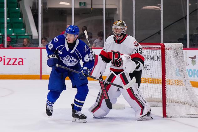 Syracuse Crunch left wing Nick Abruzzese in front of the Belleville Senators net