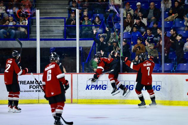 Vancouver Giants react after a goal