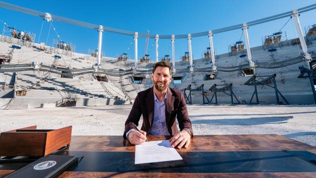 Leo Messi signing his contract extension at Miami Freedom Park
