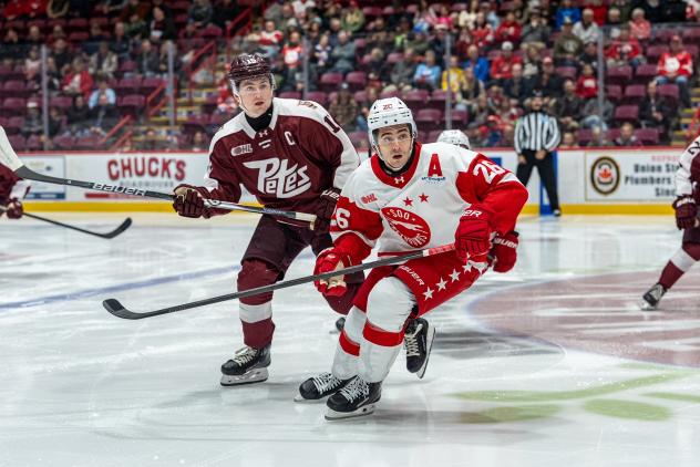 Peterborough Petes defenceman Carson Cameron (left) vs. the Soo Greyhounds