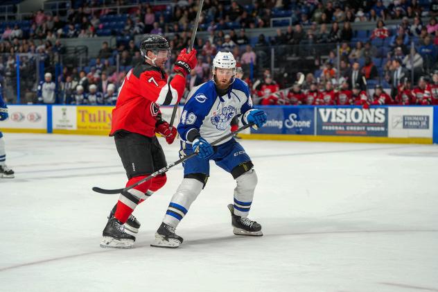 Utica Comets' Austin Strand and Syracuse Crunch's Scott Sabourin on game night