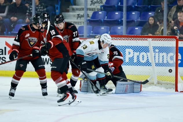 Vancouver Giants goaltender Burke Hood and his defense against the Portland Winterhawks