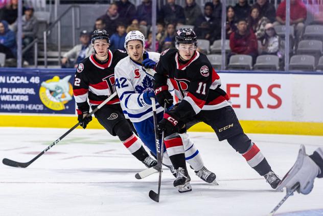 Belleville Senators defenceman Jorian Donovan (right) vs. the Toronto Marlies