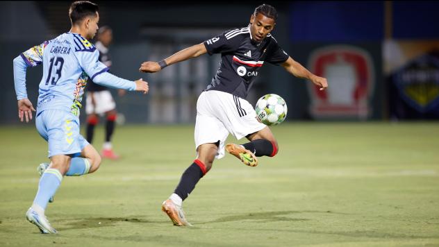 El Paso Locomotive FC's “Andy†Cabrera and Pittsburgh Riverhounds SC's Augie Williams in action