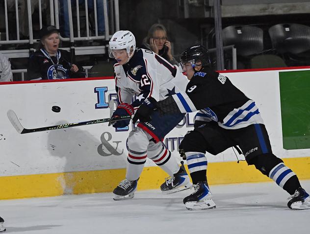 Tri-City Americans' Connor Dale battles Wenatchee Wild's Aiden Grossklaus