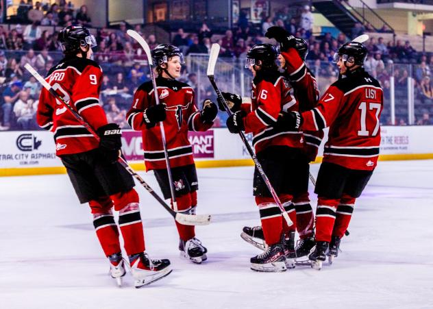 Red Deer Rebels gather following a goal