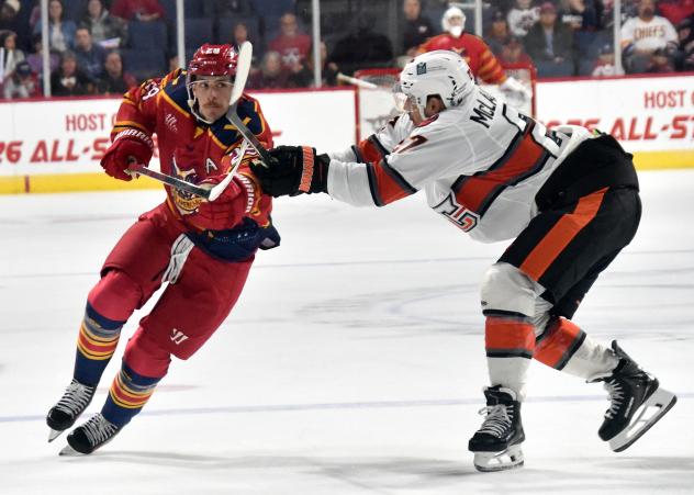 Allen Americans right wing Brayden Watts (left) vs. the Kansas City Mavericks