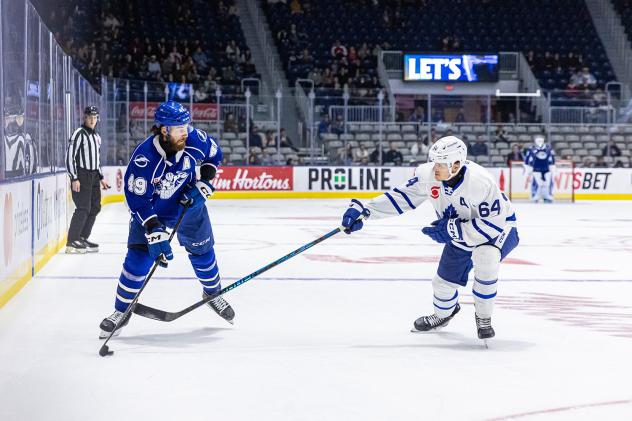 Syracuse Crunch right wing Scott Sabourin (left) vs. the Toronto Marlies