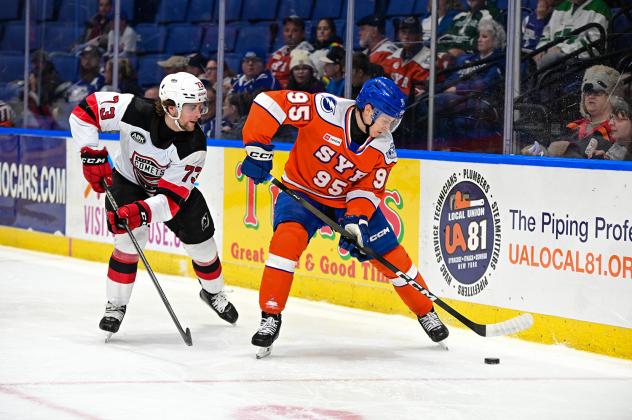 Syracuse Crunch center Gabriel Szturc handles the puck vs. the Utica Comets