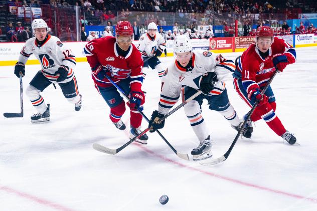 Spokane Chiefs fight for the puck against the Kamloops Blazers