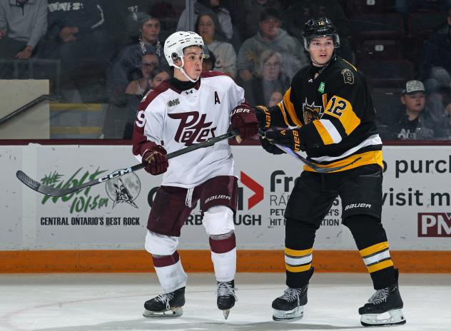 Peterborough Petes centre Braydon McCallum (left)