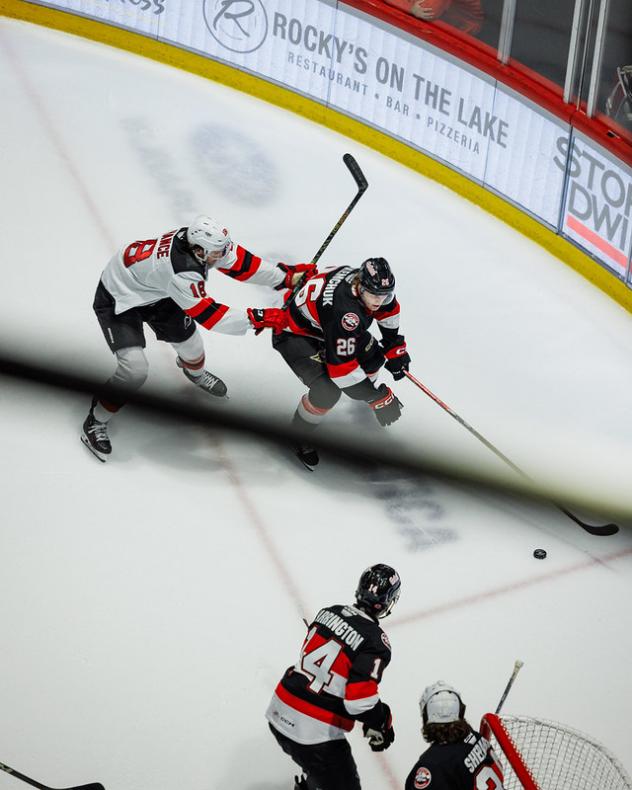 Belleville Senators defenseman Carter Yakemchuk (right)