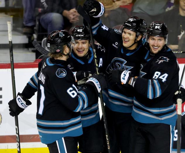San Jose Barracuda gather following a goal