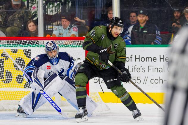 Manitoba Moose' Thomas Milic and Texas Stars' Curtis McKenzie in action
