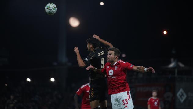 FC Tulsa's Taylor Calheira and Phoenix Rising's Rafael Czichos in action