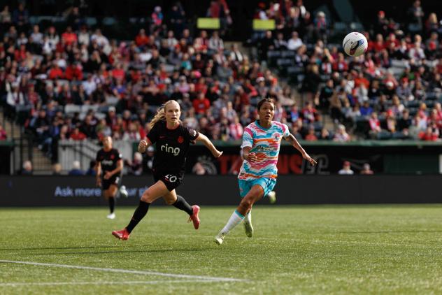 San Diego Wave FC midfielder Gia Corley (right) vs. the Portland Thorns