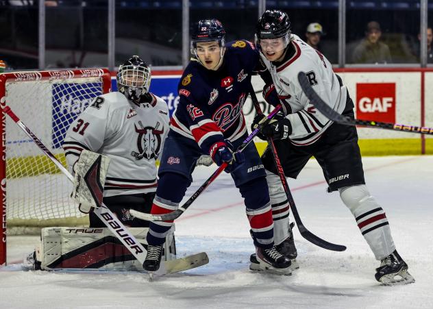 Red Deer Rebels goaltender Peyton Shore holds the Regina Pats at bay