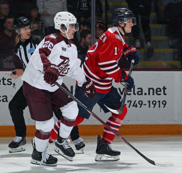 Peterborough Petes centre Aiden Young (left) vs. the Oshawa Generals