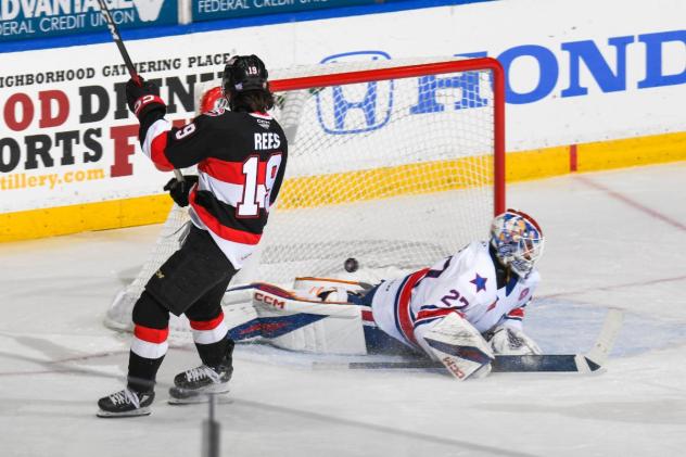 Jamieson Rees of the Belleville Senators scores against the Rochester Americans