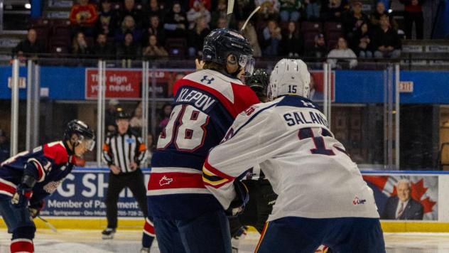 Saginaw Spirit right wing Nikita Klepov (left) vs. the Barrie Colts