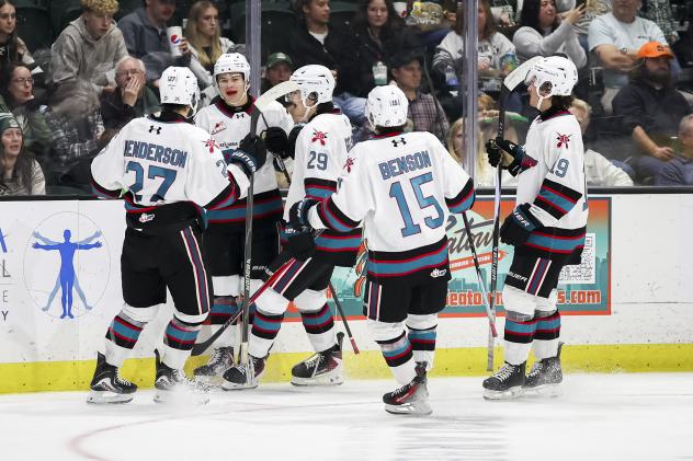Kelowna Rockets gather after a goal