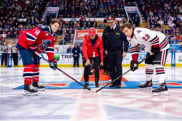 Kitchener Rangers in the ceremonial faceoff with the Guelph Storm