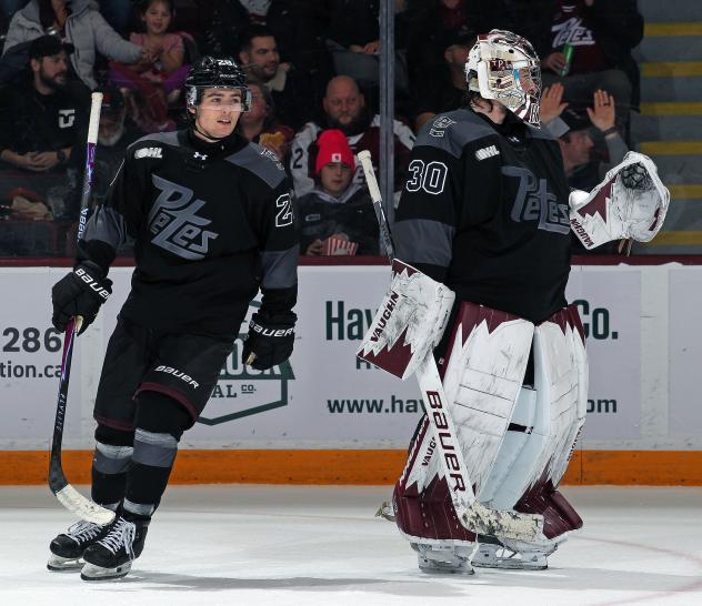 Peterborough Petes left wing Brennan Faulkner and goaltender Easton Rye