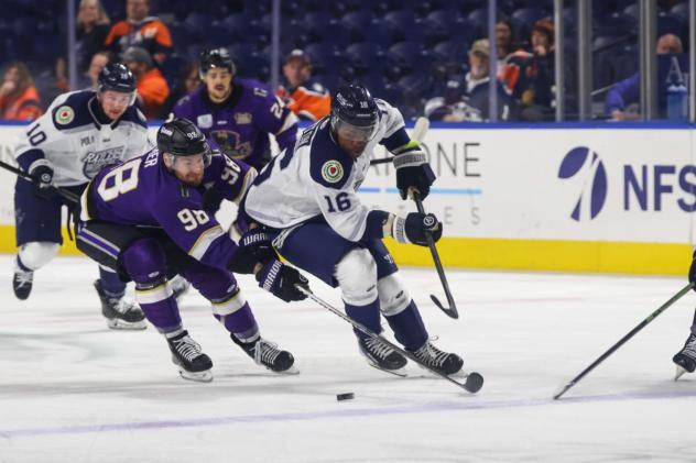 Worcester Railers forward Ross Mitton (right) races for the puck