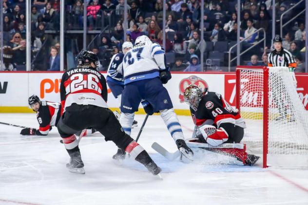 Belleville Senators goaltender Mads Søgaard makes a stop against the Manitoba Moose