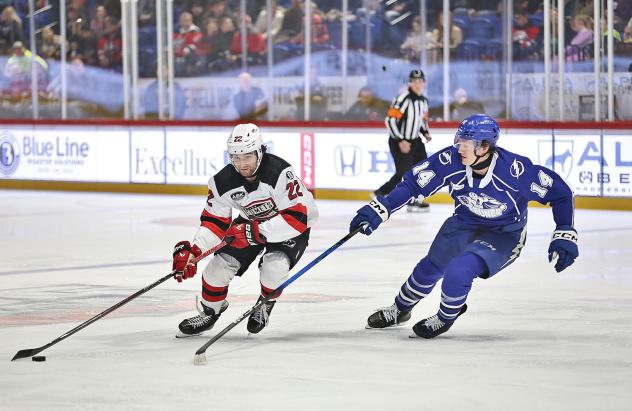 Syracuse Crunch center Tristan Allard (right) vs. the Utica Comets