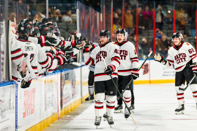 Rapid City Rush exchange congratulations with the bench