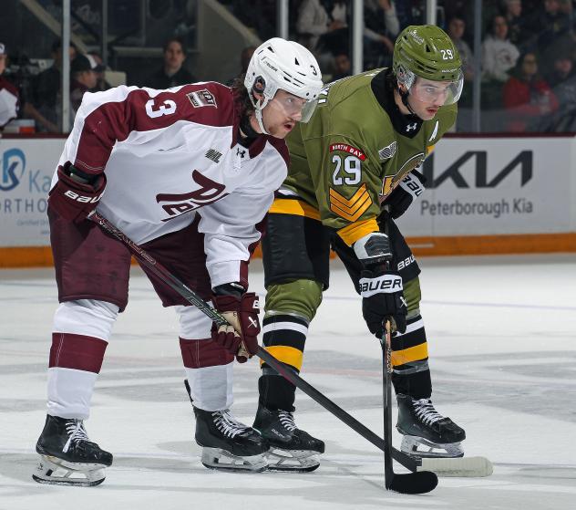 Peterborough Petes defenceman Thanasi Marentette (left) vs. the North Bay Battalion