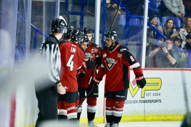 Vancouver Giants gather after a goal against the Everett Silvertips