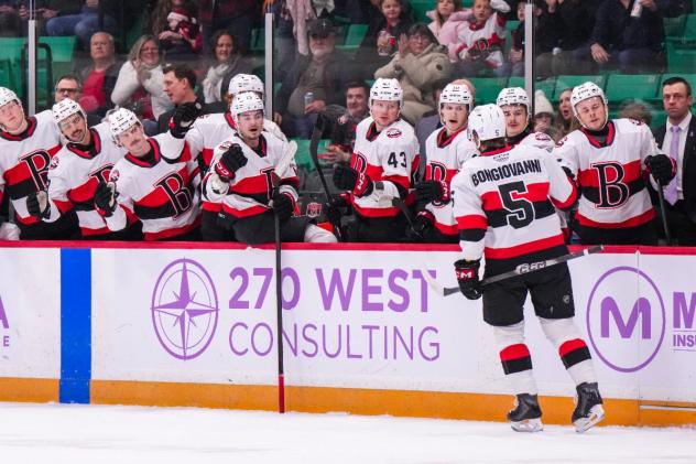 Belleville Senators centre Wyatt Bongiovanni receives congratulations along the bench