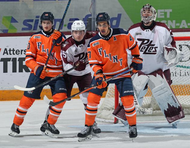 Peterborough Petes goaltender Easton Rye and defenceman Carson Cameron vs. the Flint Firebirds