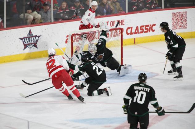 Allen Americans' Colby McAuley battles Utah Grizzlies' Christophe Fillion and Dylan Wells